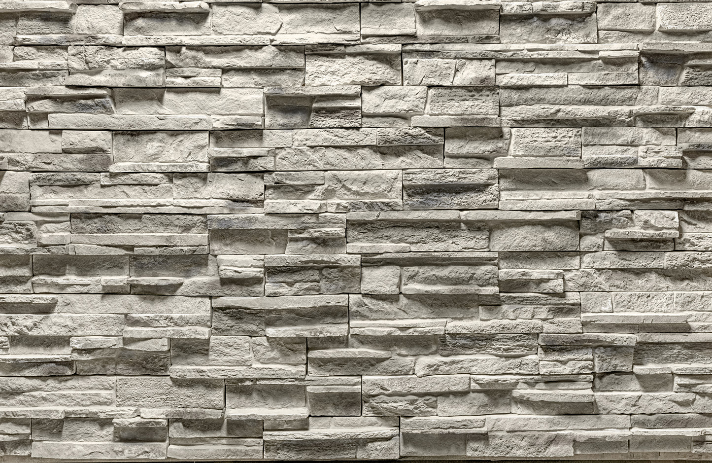 Pattern of stacked stone bricks in a brick wall