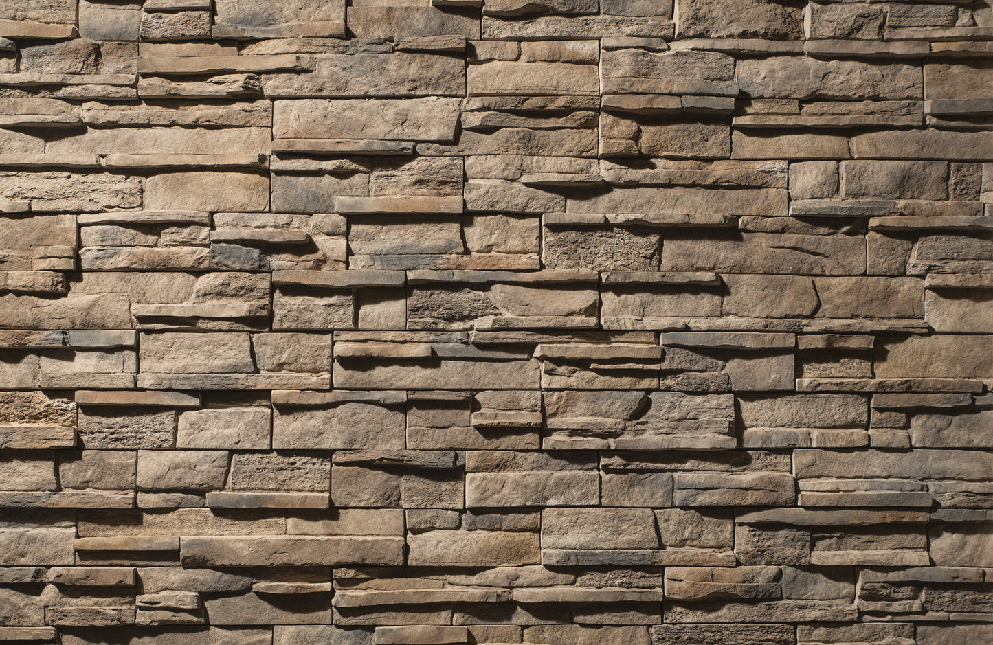 Pattern of stacked stone tiles in various shades of brown.