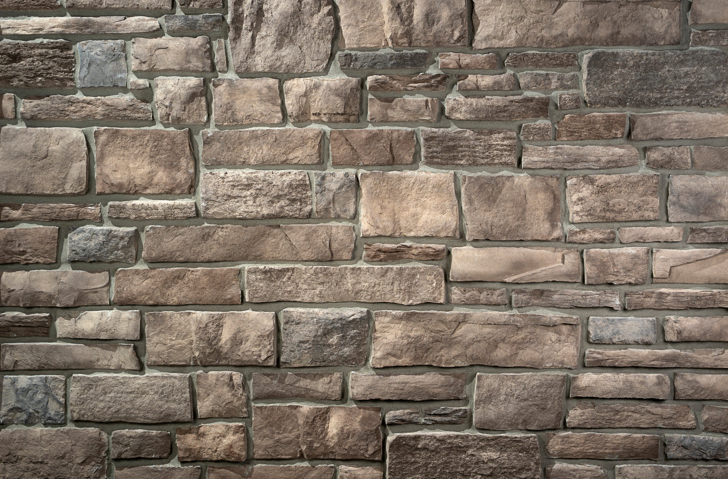 Close-up of a stone wall with various shades of brown and gray.