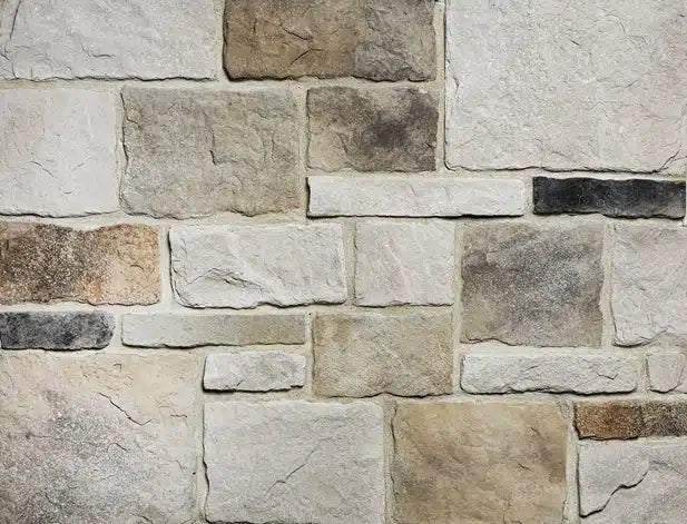 Casa Di Sassi Osso Volterra veneer featuring warm bone-toned stone colors, refined textured surfaces, and classic European masonry character.