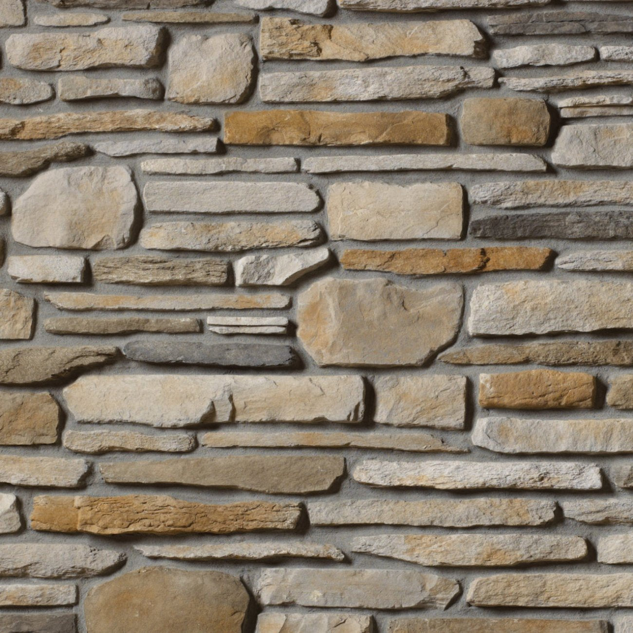 Cultured Stone Aspen Southern Ledgestone veneer featuring soft cream and light gray tones, layered stacked stone texture, and natural stone depth