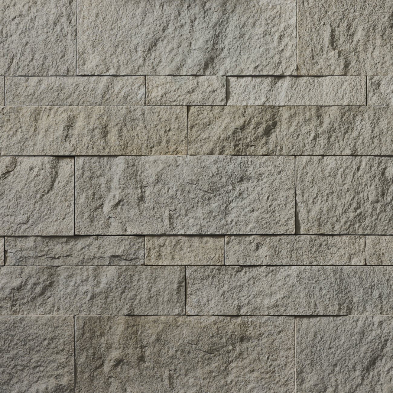 Cultured Stone Span Hewn Stone veneer featuring balanced neutral tones, rugged chiseled hewn texture, and authentic natural stone character.