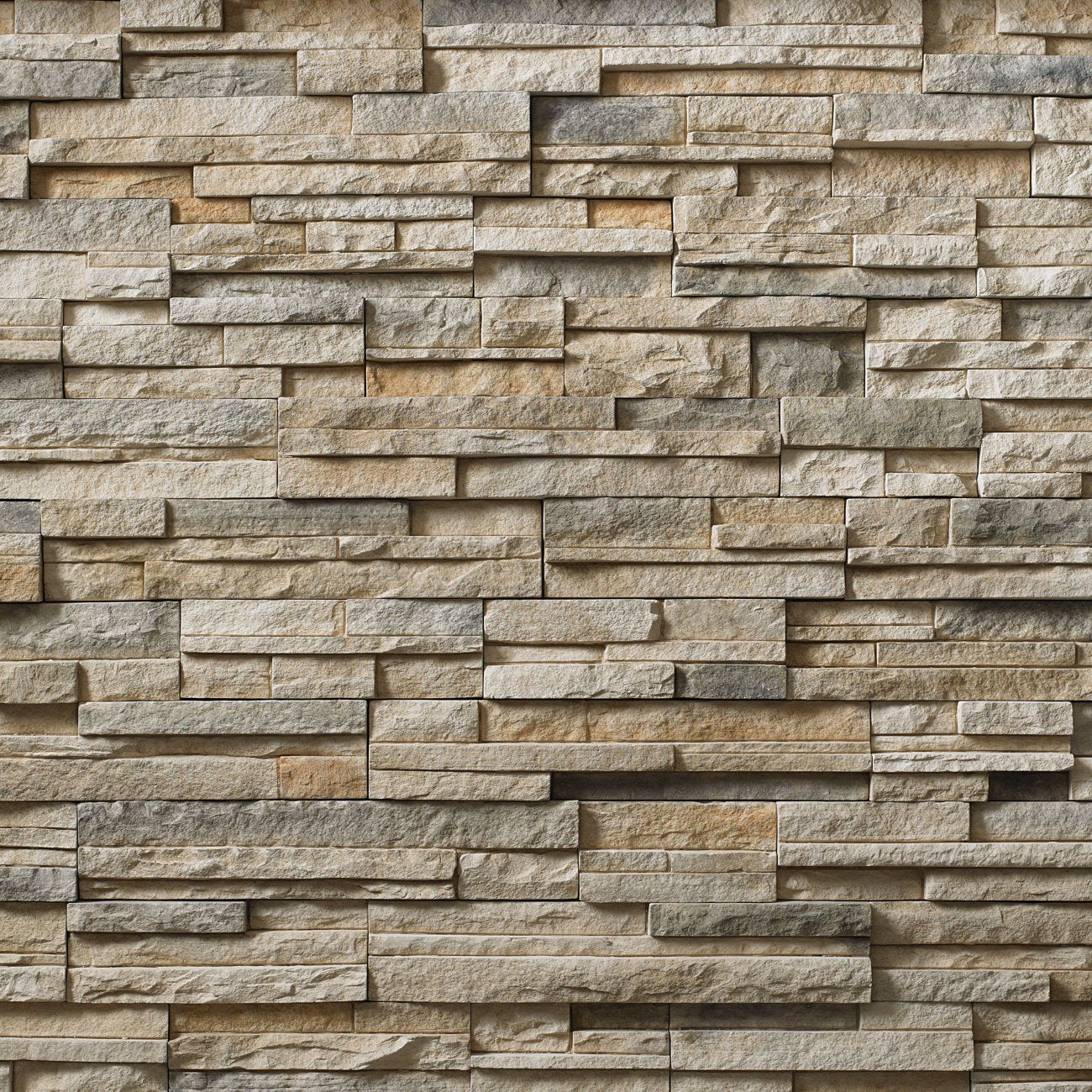 Cultured Stone Summit Peak Pro-Fit Alpine Ledgestone veneer featuring light gray and beige tones, layered alpine texture, and natural stone depth.