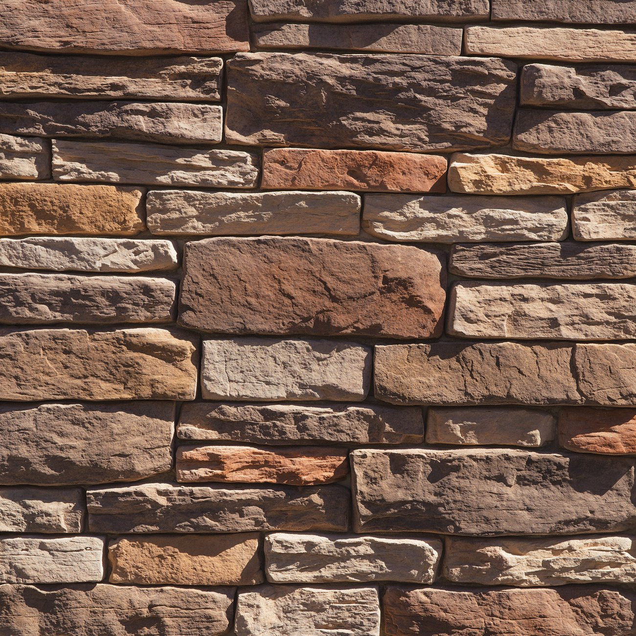 Dutch Quality Autumn Blend Stack Ledge veneer featuring warm earth tones, layered stacked texture, and dimensional ledgestone character