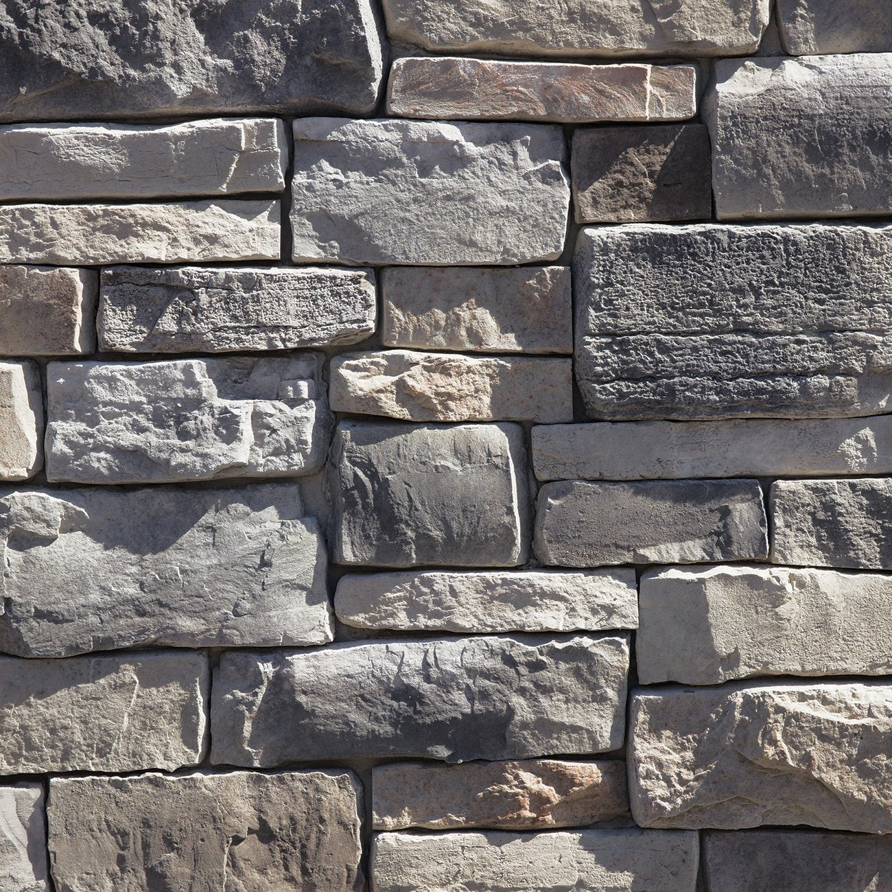 Dutch Quality Elkwood Weather Ledge veneer featuring warm brown and taupe tones, weathered layered texture, and rugged dimensional ledgestone character