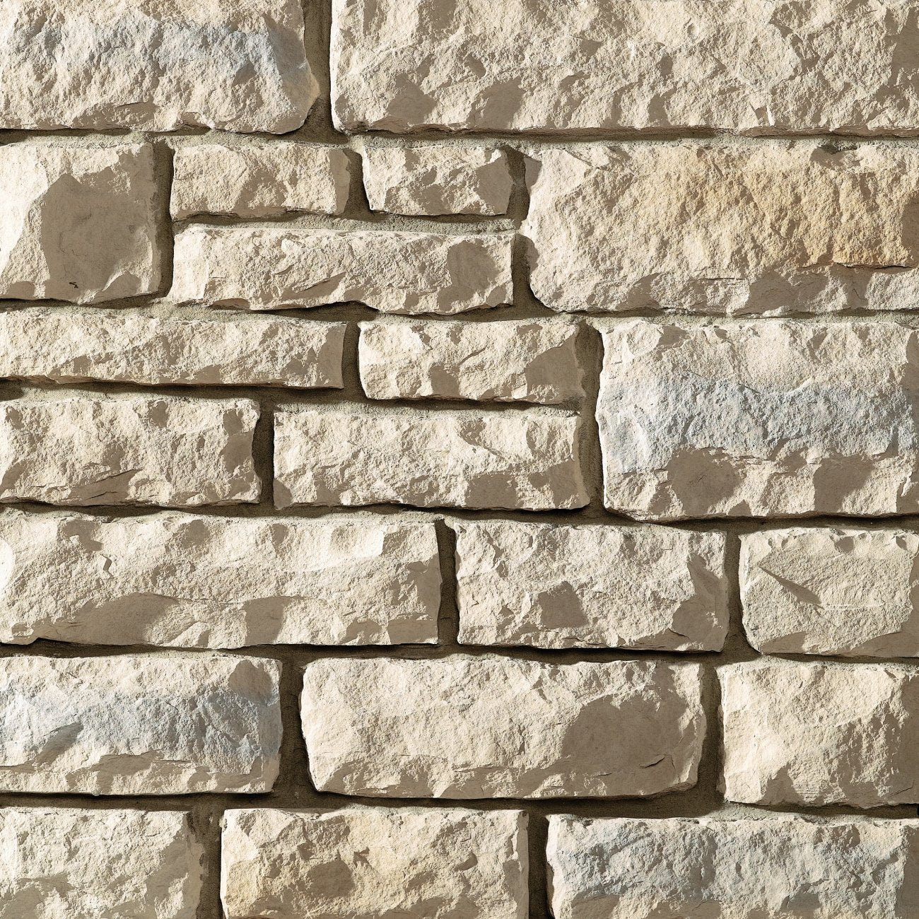 Dutch Quality Great Lakes Limestone veneer featuring cool gray and blue tones, chiseled limestone texture, and clean rectangular stone profiles