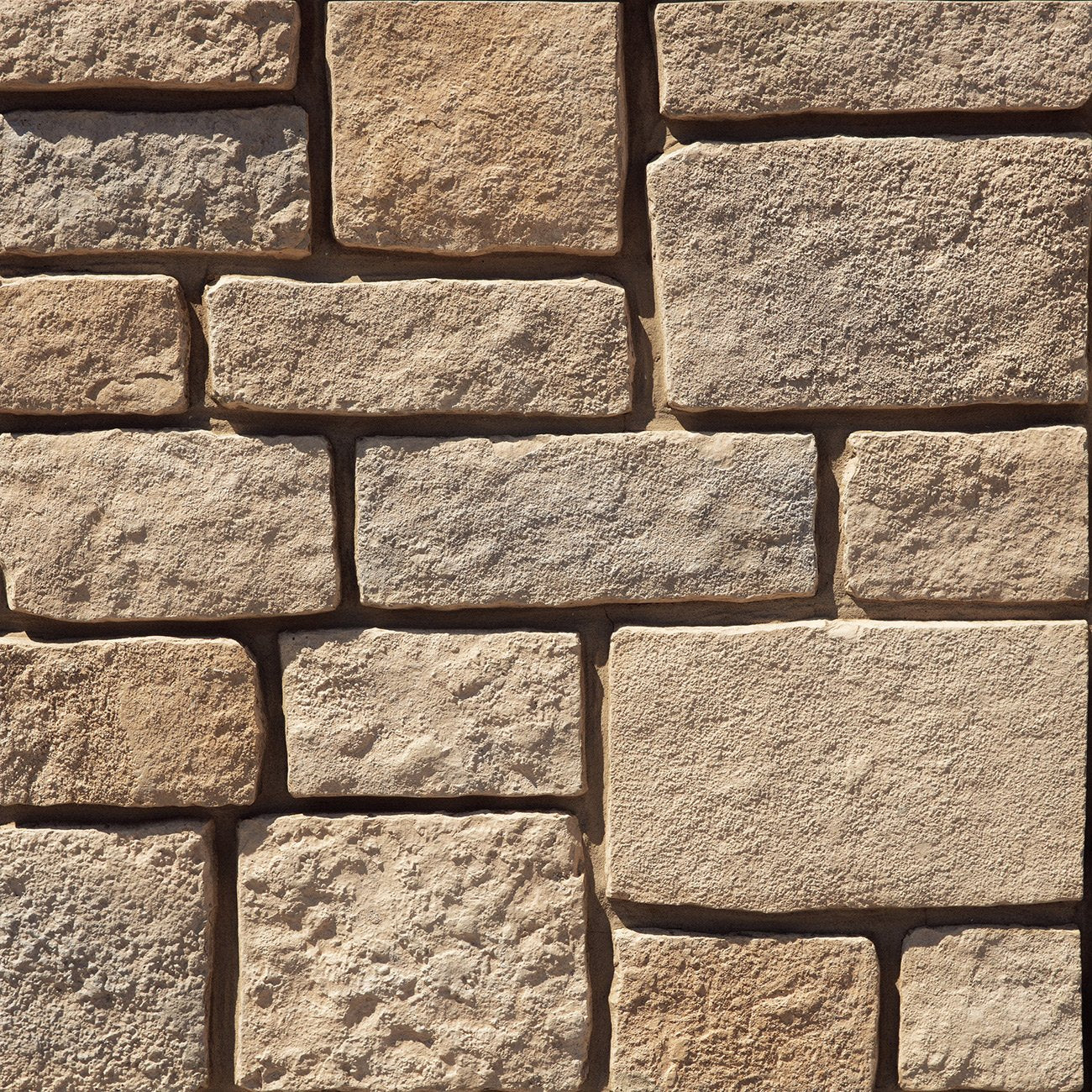 Dutch Quality Trailhead Rough Ashlar veneer featuring warm earth tones, rugged split-face texture, and classic ashlar stone pattern