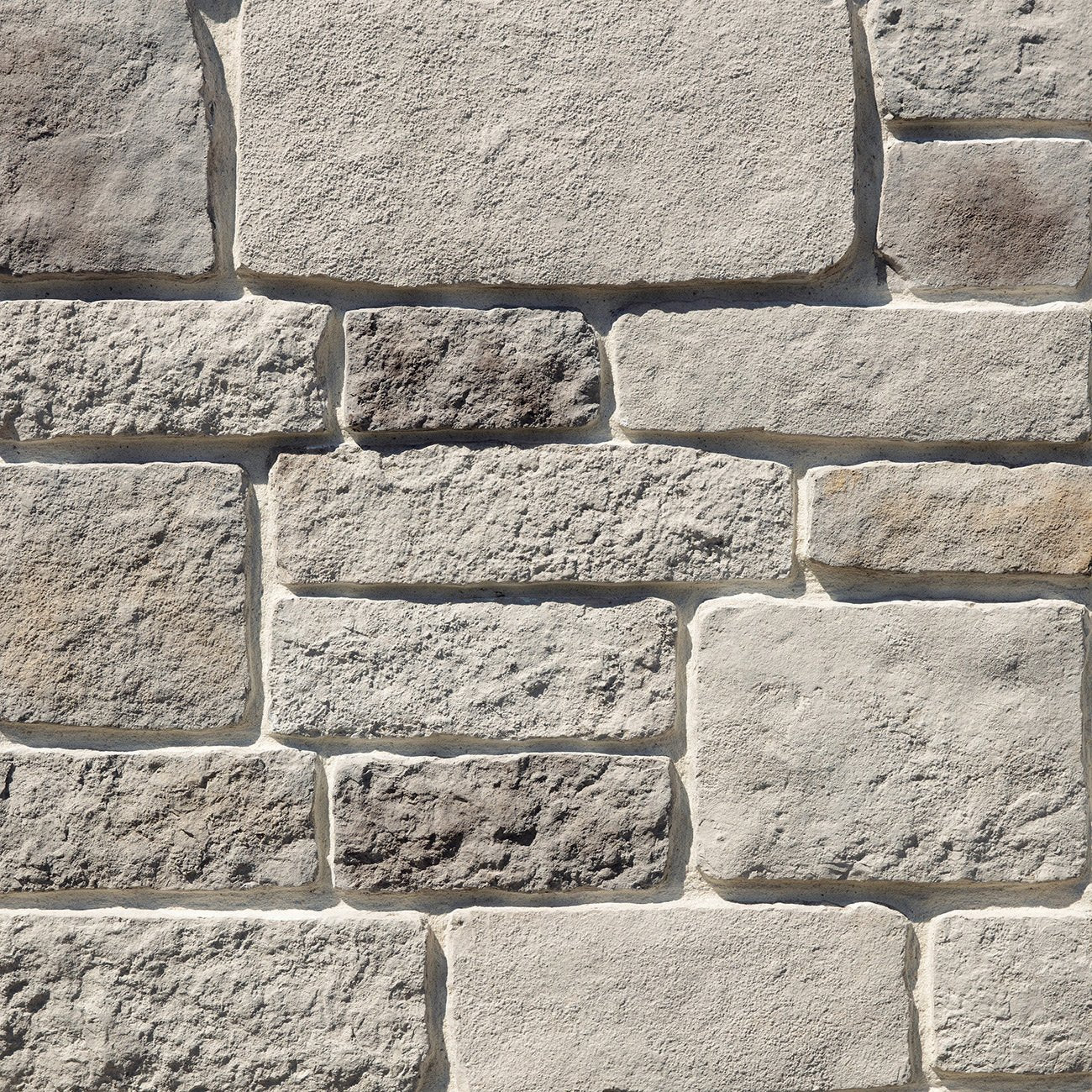 Dutch Quality Winter Point Rough Ashlar veneer featuring cool gray and taupe tones, rugged split-face texture, and classic ashlar stone pattern