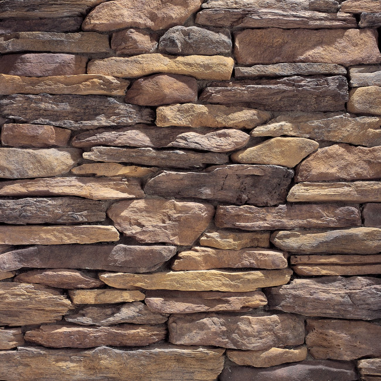 Eldorado Bluffstone Bodega stone veneer in warm earth tones with rugged stacked texture