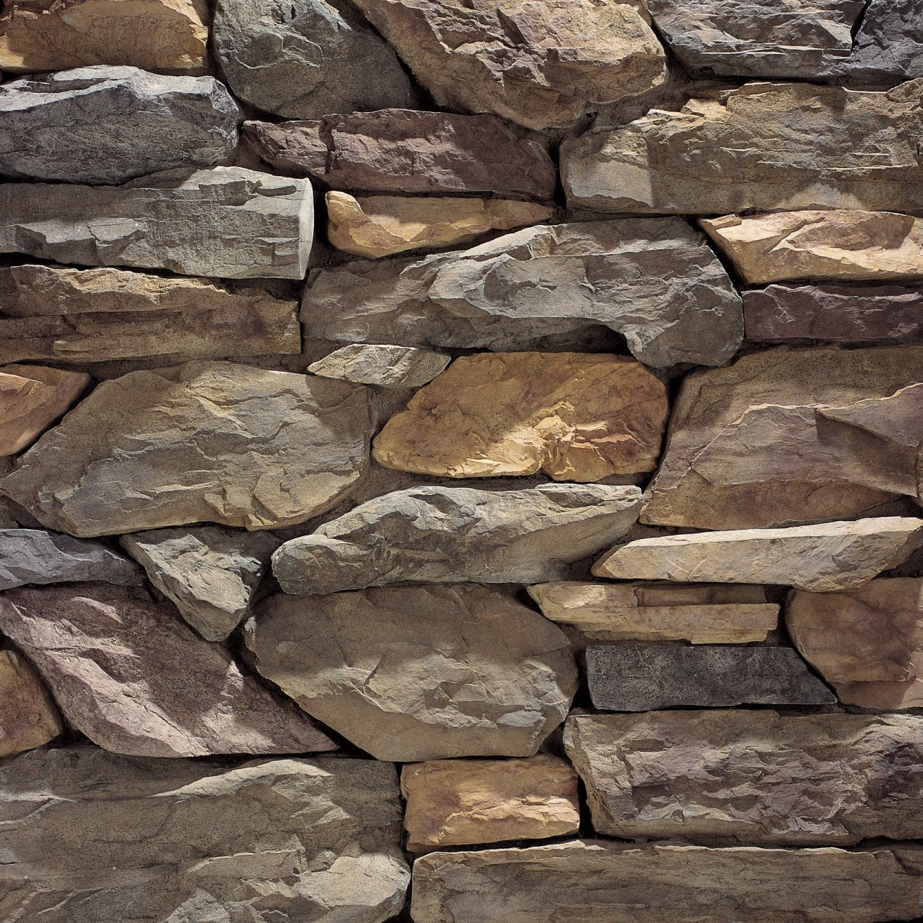 Eldorado Bronze Shadow Rock with rugged, irregular stone faces in warm bronze and earthy brown tones