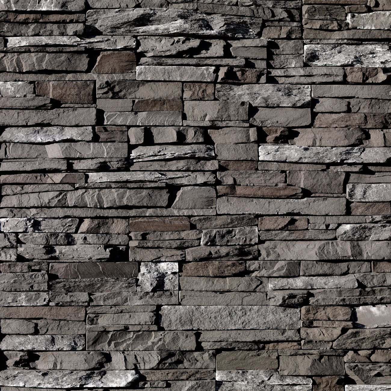 Eldorado Dark Rundle Stacked Stone with tightly fitted linear stones in dark charcoal, slate gray, and brown tones