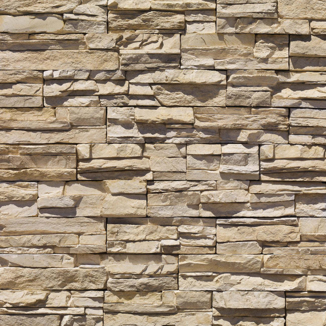 Eldorado Dry Creek Stacked Stone with tightly fitted linear stones in warm brown, tan, and muted gray tones
