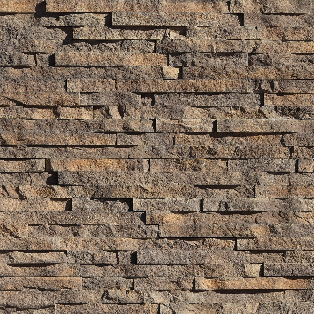 Eldorado Iron Mill European Ledge stone veneer in charcoal and gray hues with linear, chiseled stone texture