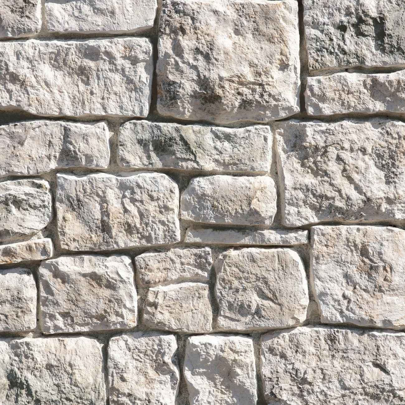 Eldorado Loire Valley RoughCut stone with rugged chiseled texture in warm cream, taupe, and beige tones