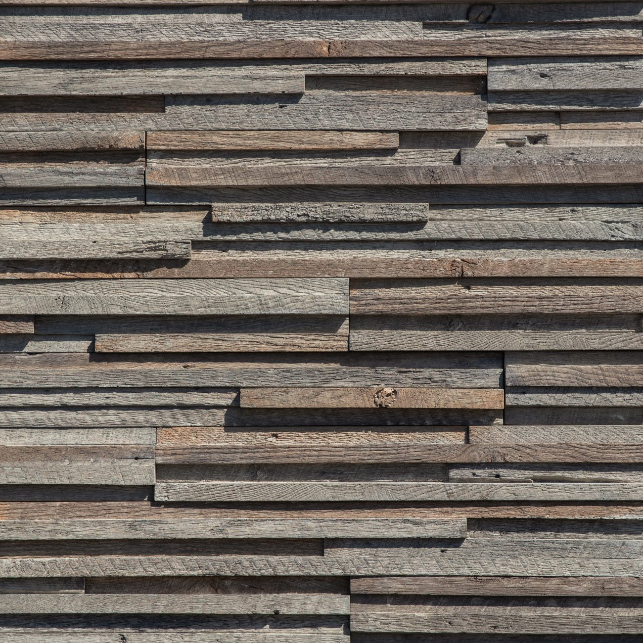 Eldorado Shelter Cove Rivenwood stone with realistic driftwood-style grain in soft gray and weathered brown tones