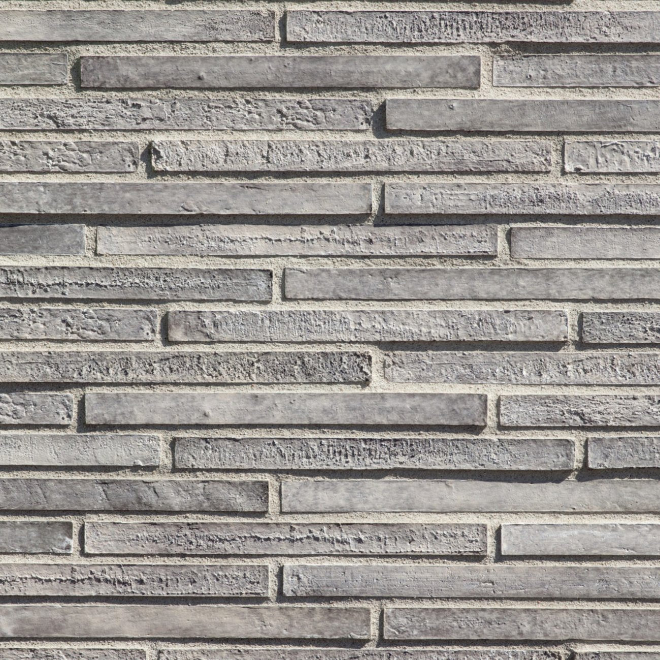 Eldorado Talavera LoreioBrick thin brick-style stone veneer in warm terracotta, brown, and tan tones with subtle texture