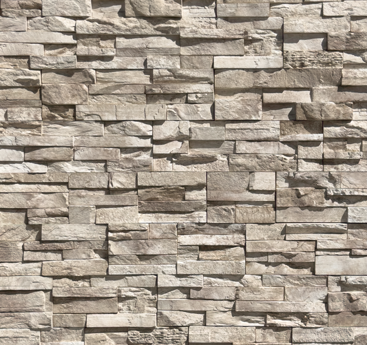 Pattern of stacked stone tiles in various shades of brown and gray.