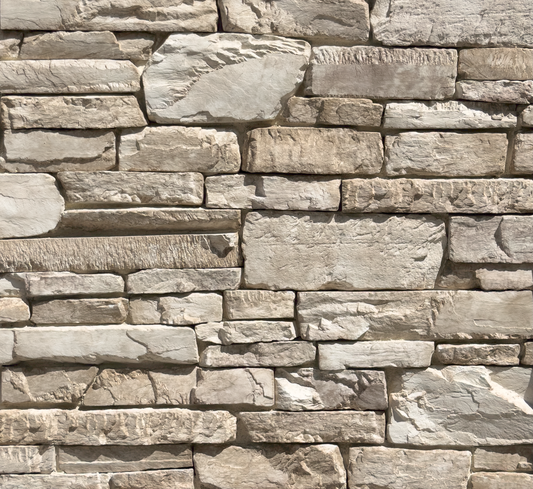 Close-up of a stone wall with varying stone sizes and colors.