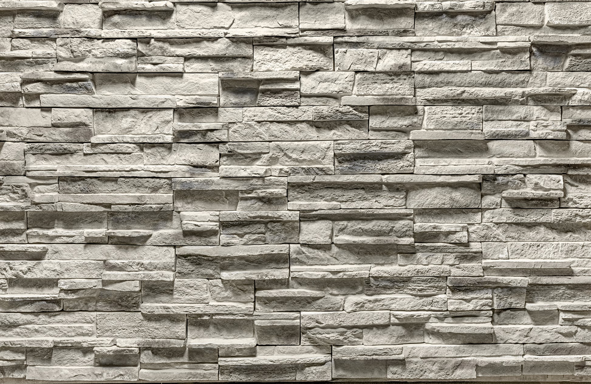 Pattern of stacked stone bricks in a brick wall