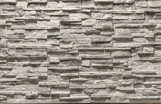 Pattern of stacked stone bricks in a brick wall