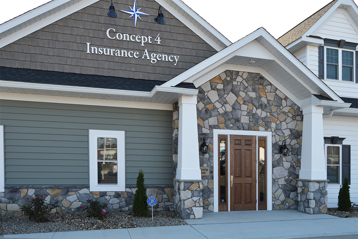 Concept 4 Insurance Agency building with stone facade and wooden door.
