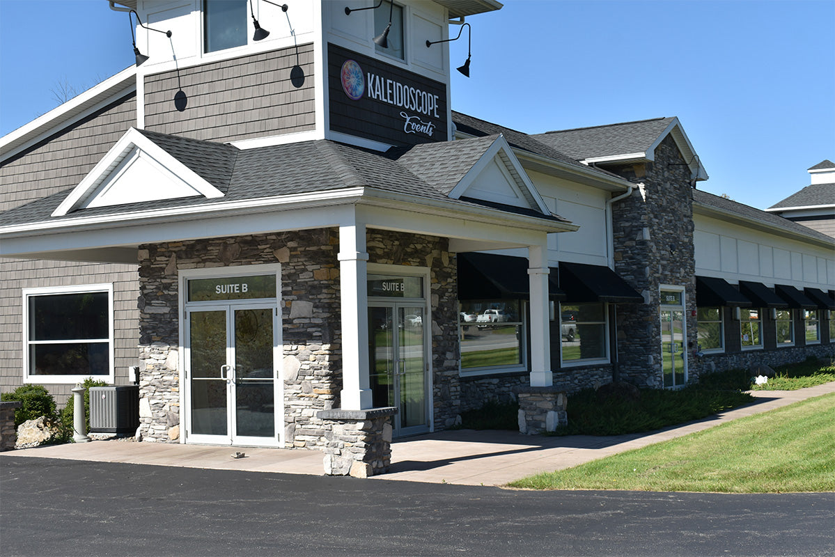 Building exterior with stone facade and 'Halesoscope' sign on a clear day