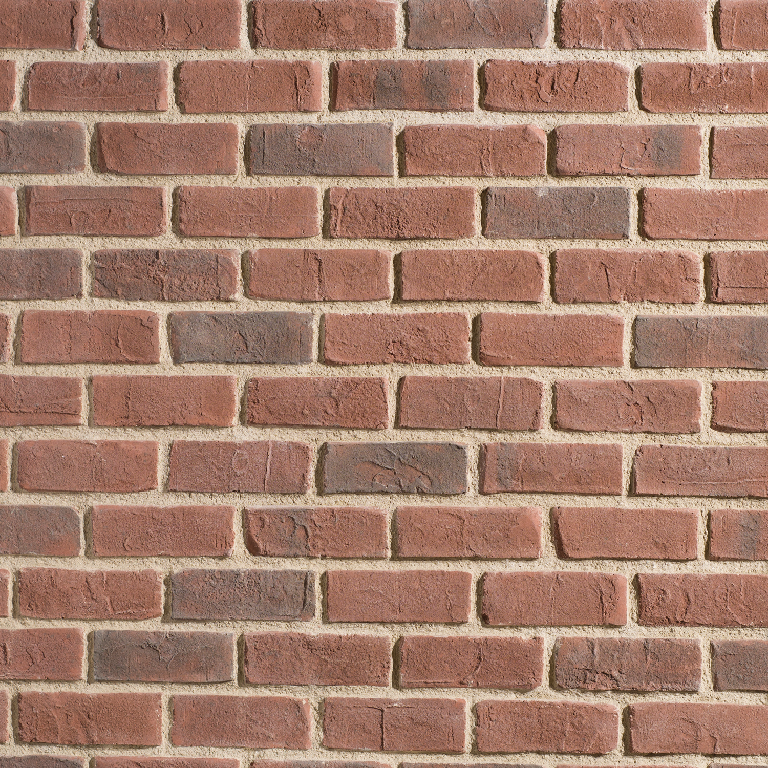 Red brick wall pattern with textured reddish-brown bricks and light beige mortar lines.