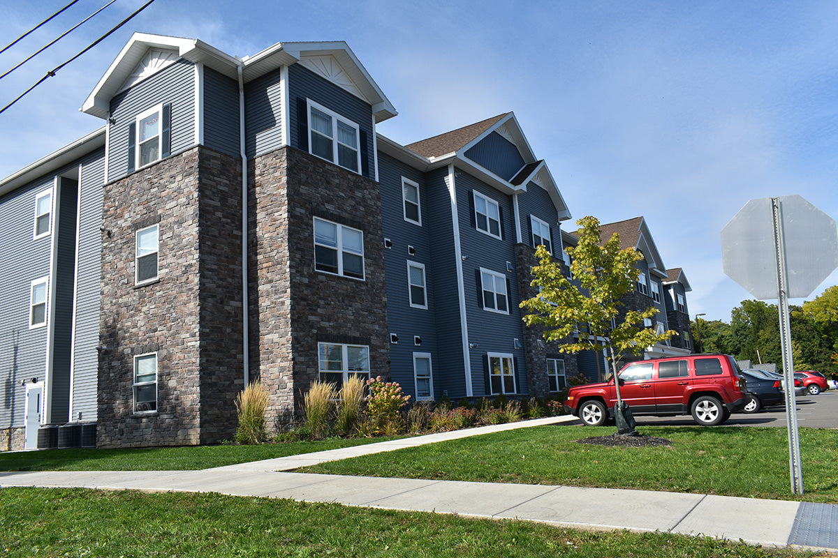 Multistory apartment building with a clear blue sky