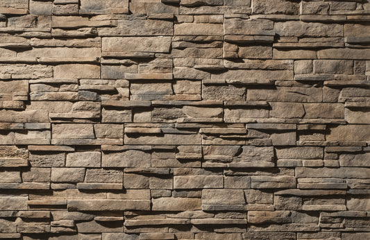 Pattern of stacked stone tiles in various shades of brown.