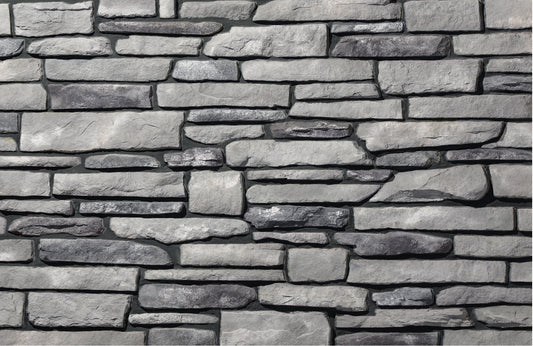 Pattern of stacked stone bricks in a decorative wall design.