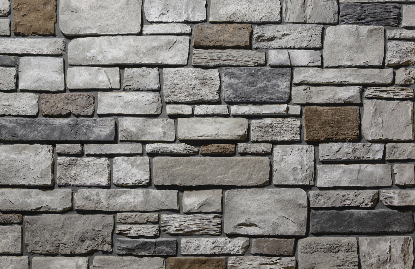 Pattern of stone tiles in various shades of gray and brown.