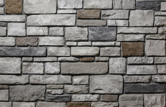 Pattern of stone tiles in various shades of gray and brown.