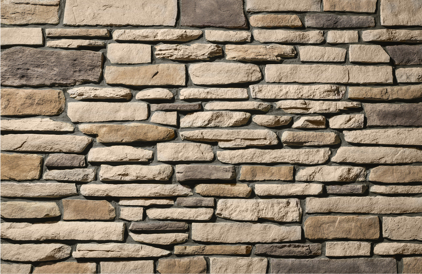Close-up of a stone wall with various shades of brown and beige.