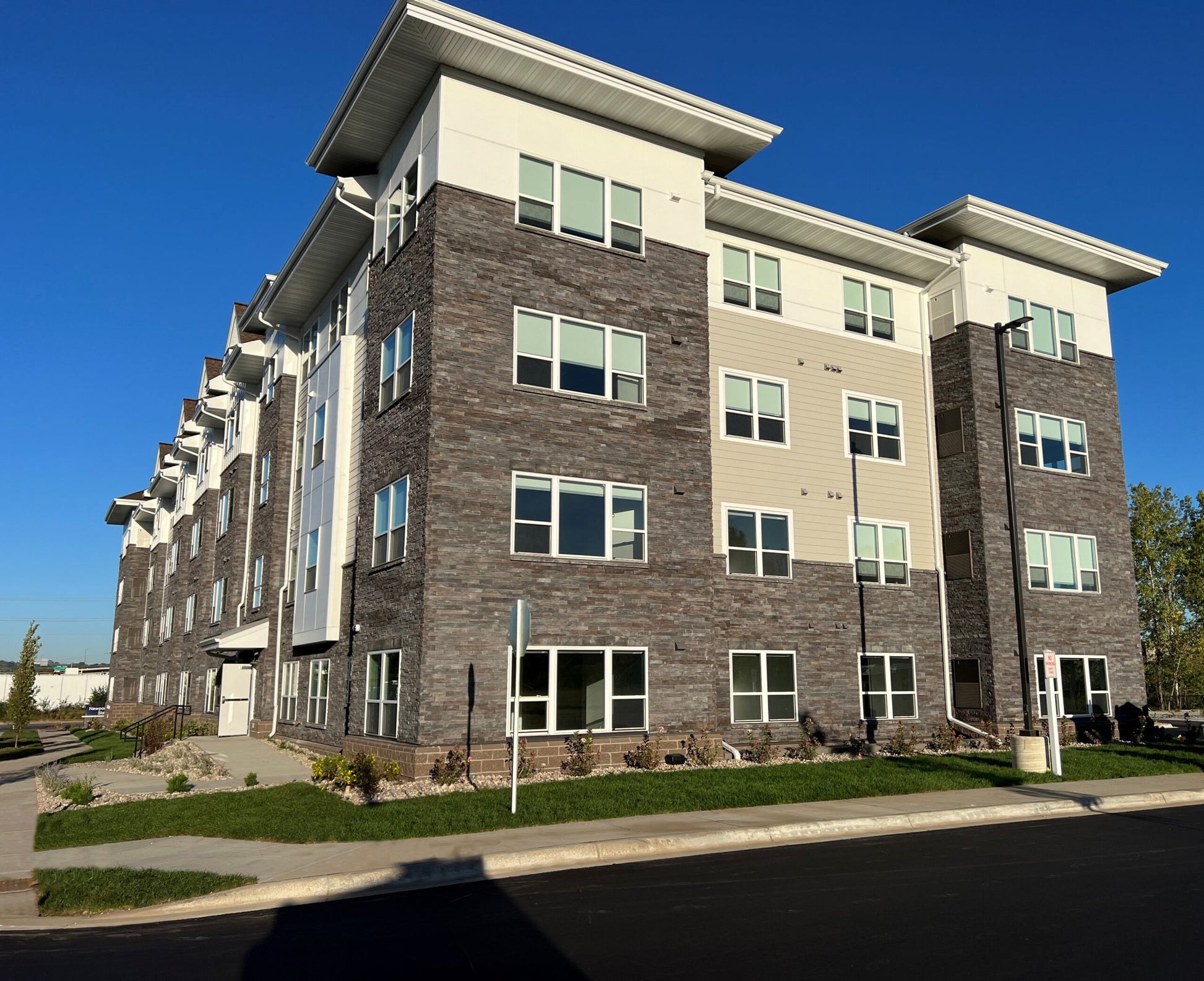 Multistory apartment building with modern design on a clear day