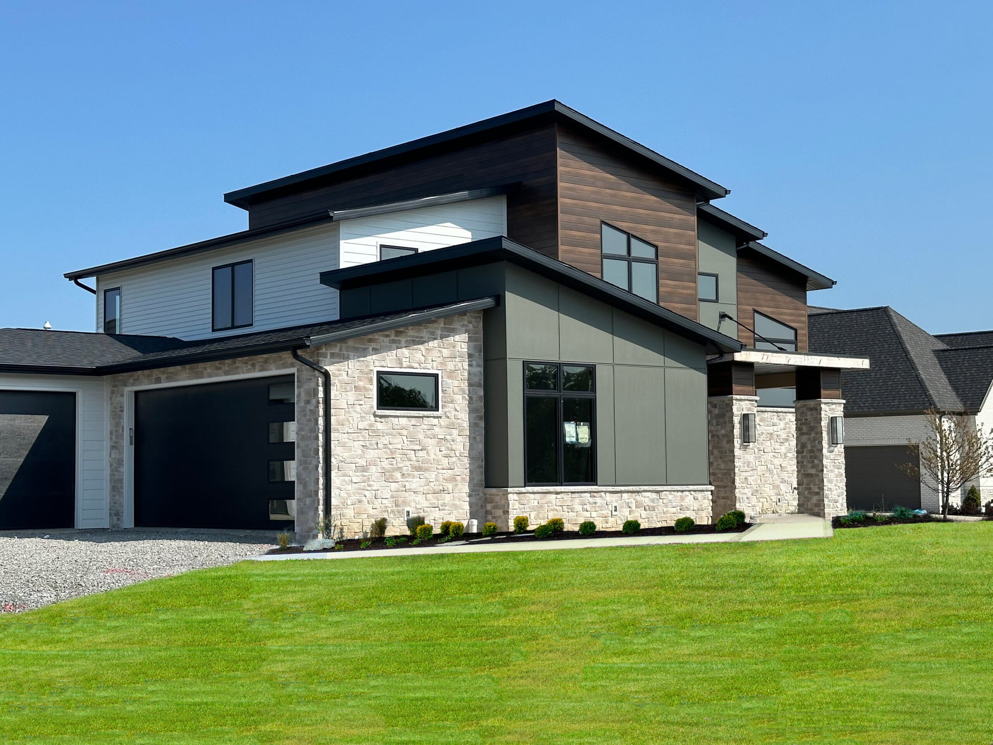 Modern house with a combination of wood, stone, and glass exterior