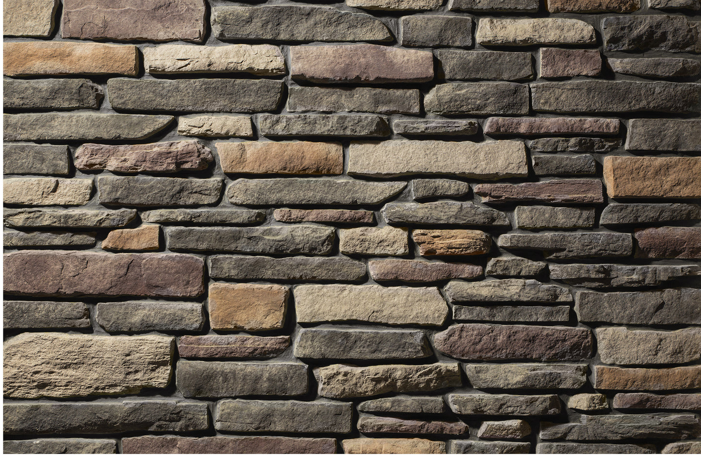 Pattern of stacked stone bricks in various shades of brown and gray.