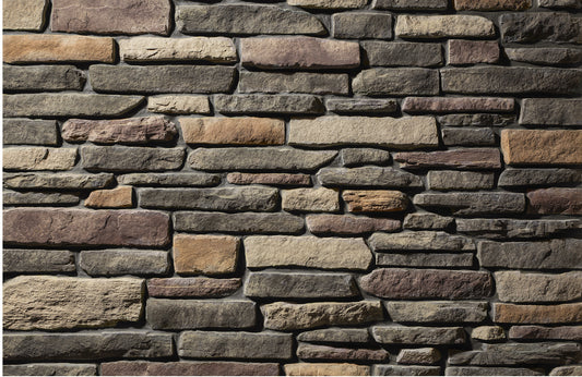 Pattern of stacked stone bricks in various shades of brown and gray.