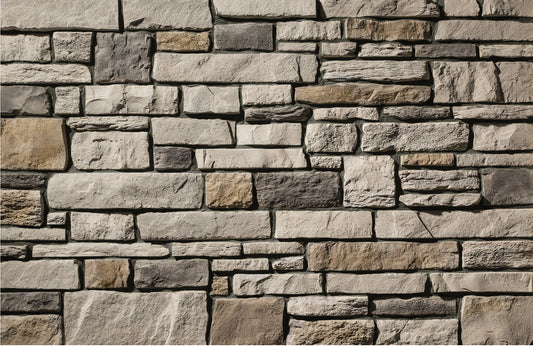 Close-up of a stone wall with various shades of brown and gray.