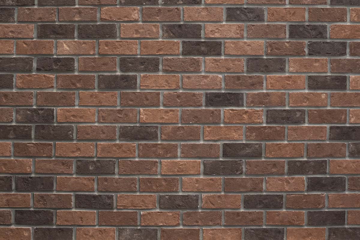 Pattern of brown and black bricks