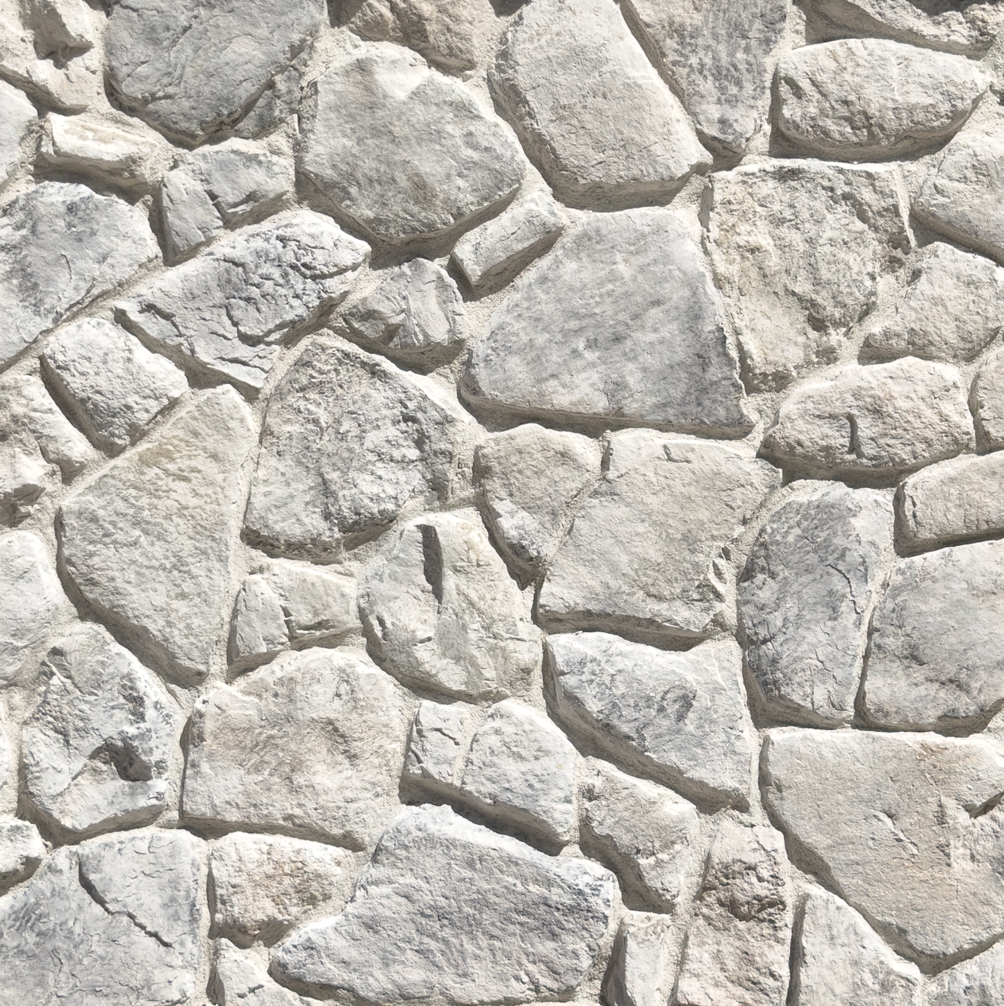 Light gray and off-white irregular stone wall texture with natural-looking mortar lines.
