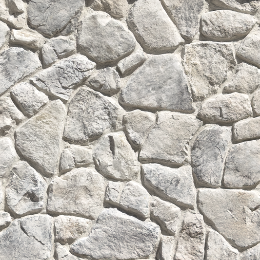 Light gray and off-white irregular stone wall texture with natural-looking mortar lines.