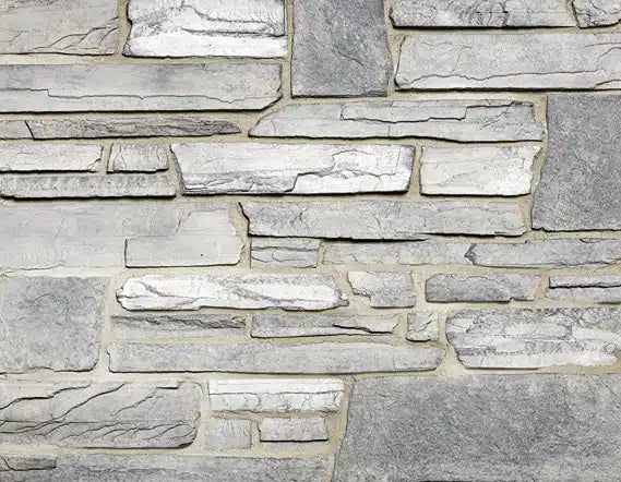 Casa Di Sassi Ardesia Quartz Ledge veneer featuring dark slate-inspired quartz tones, linear stacked stone profile, and bold modern architectural texture