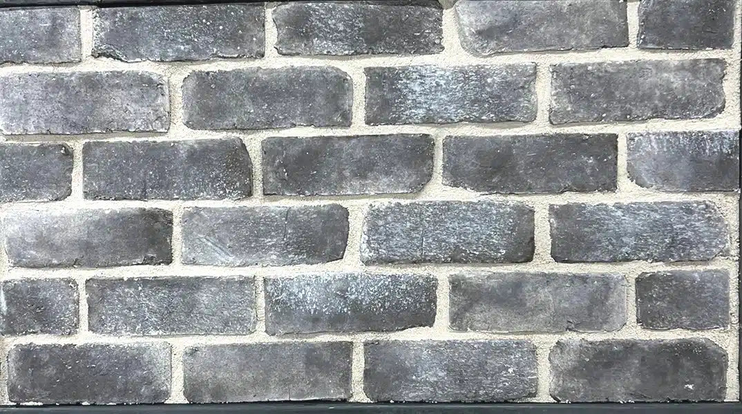 Casa Di Sassi Carbone 1-inch brick veneer featuring deep charcoal tones, slim linear brick format, and modern architectural texture