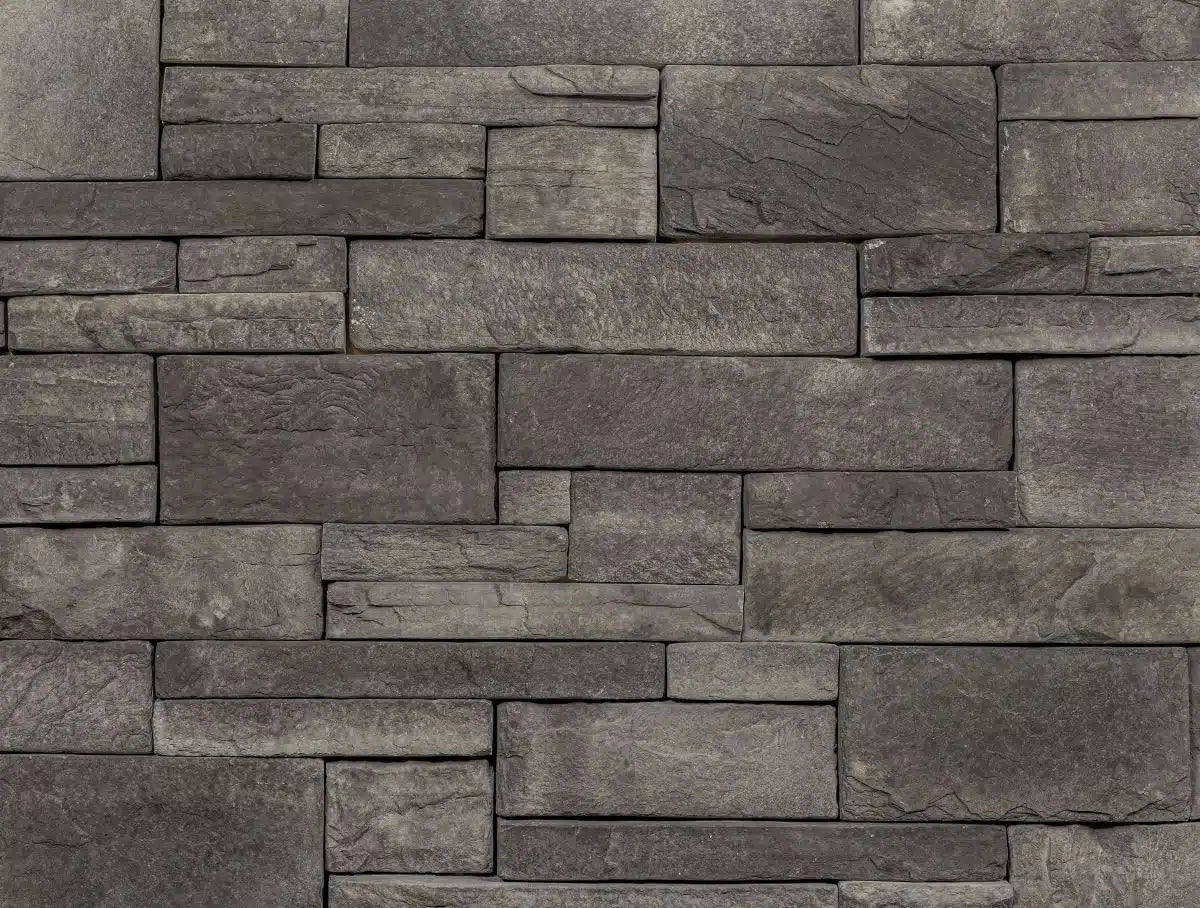 Casa Di Sassi Carbone EZ Ledge veneer featuring deep charcoal stone tones, linear stacked stone profile, and bold modern architectural texture.