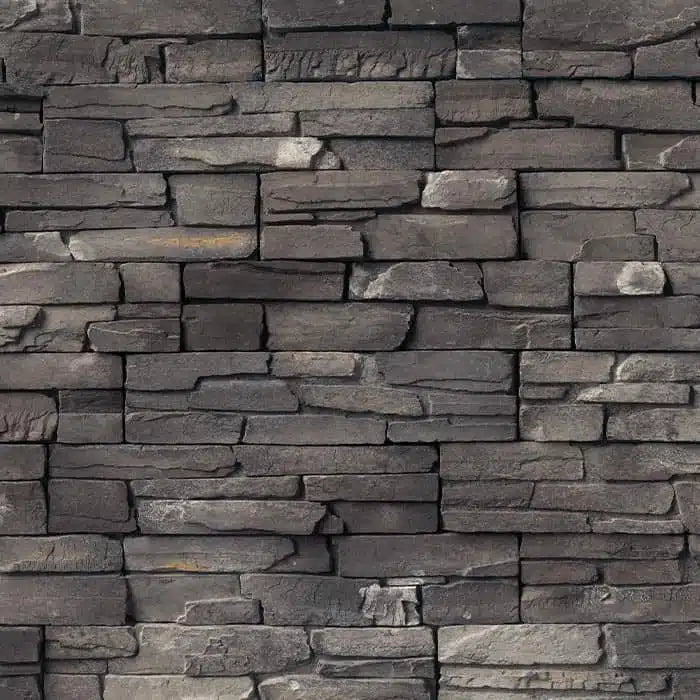 Casa Di Sassi Carbone Kwik Stack veneer featuring deep charcoal stone tones, layered stacked stone profile, and bold modern architectural texture