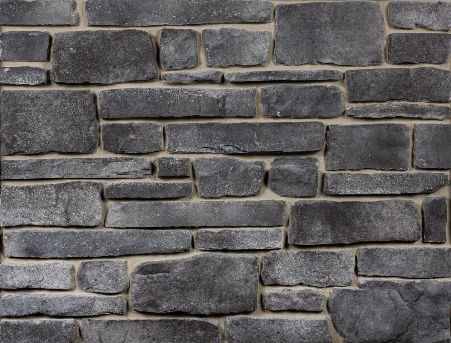 Casa Di Sassi Carbone Ledgestone veneer featuring dark charcoal tones, stacked stone texture, and bold modern natural stone character