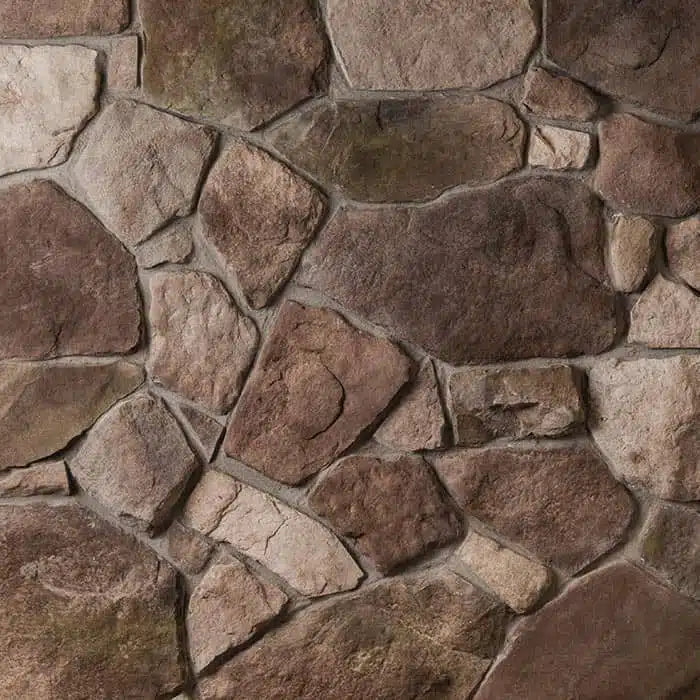 Casa Di Sassi Legno Fieldstone veneer featuring irregular stone shapes, warm wood-inspired tones, and rustic natural texture