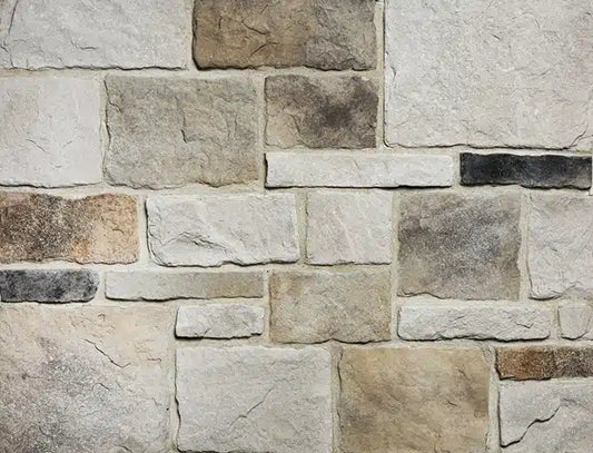 Casa Di Sassi Osso Volterra veneer featuring warm bone-toned stone colors, refined textured surfaces, and classic European masonry character.