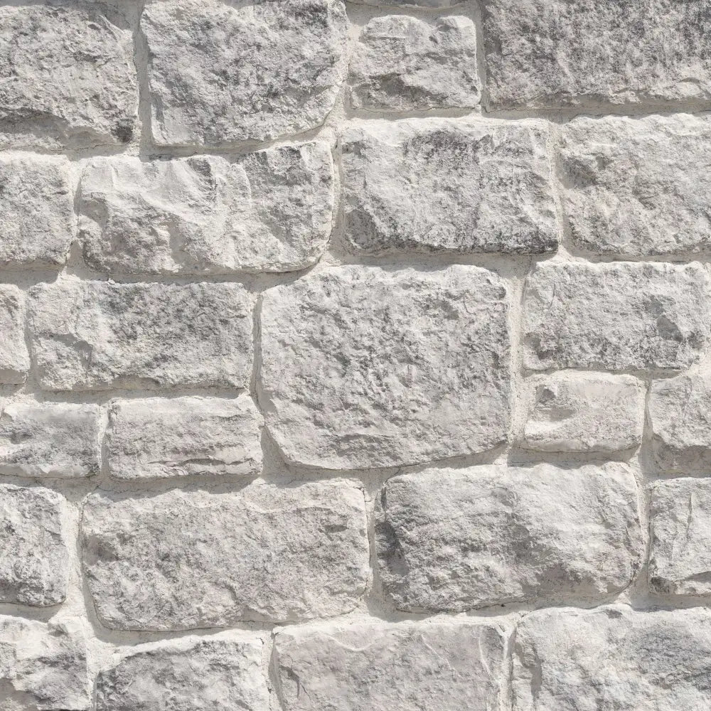 Authentic Cloudbreak Craft Orchard Limestone stone veneer with soft grey and off-white tones and natural texture, handcrafted by Creative Mines®.