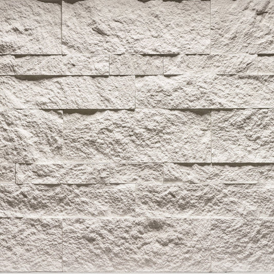 Cultured Stone Arctic Hewn Stone veneer featuring crisp light tones, rugged chiseled hewn texture, and authentic natural stone character